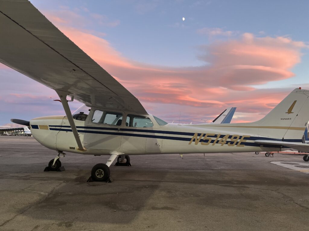 Airplane landed with the golden hour sky in the background